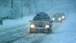 cars driving in snow